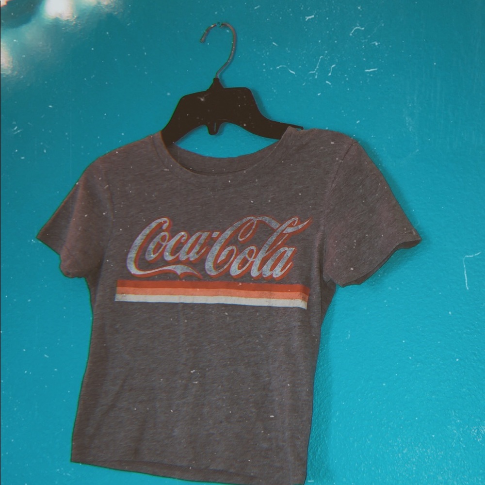 A crop top Coca Cola shirt